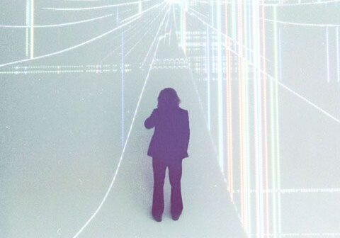 Silhouette of person in futuristic digital space.