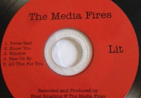 Red music CD titled "The Media Fires.