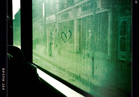 Heart drawn on a foggy window.