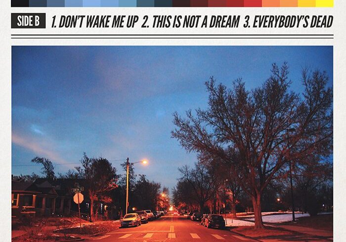 Album cover with street at dusk scene.
