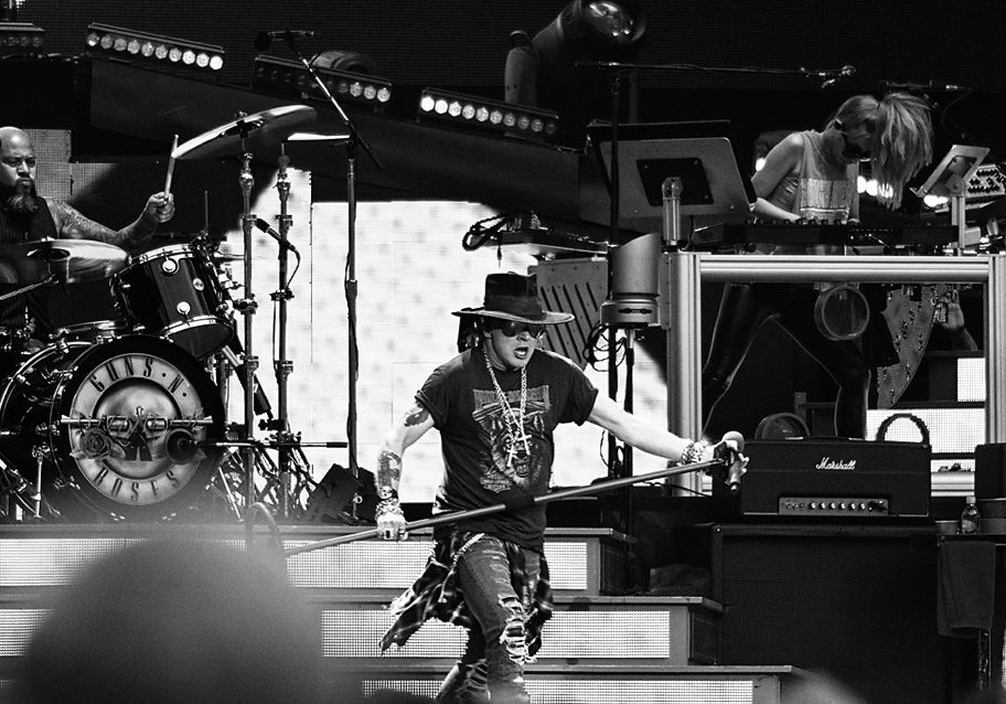 Rock band performing live on stage.