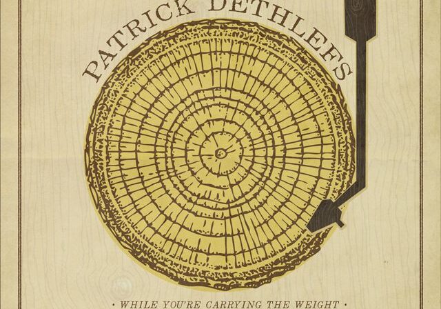 Tree ring and arrow on album cover.