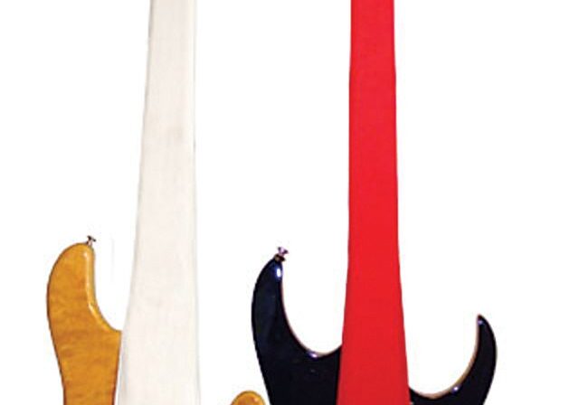 Two guitars with protective neck covers.