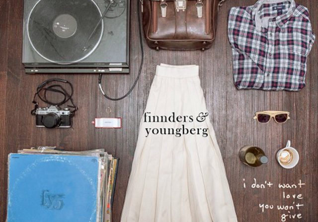 Vintage items arranged on wooden floor.