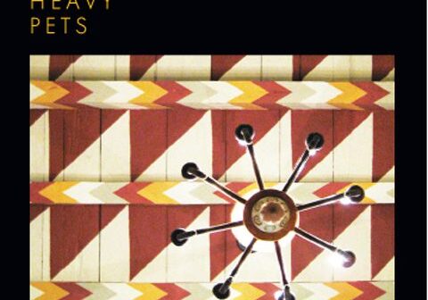 Ceiling design with geometric pattern and chandelier.