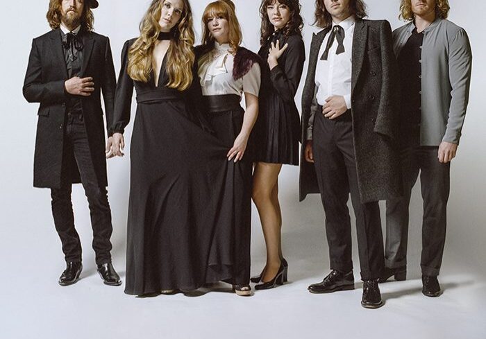 Group of six people in formal attire.