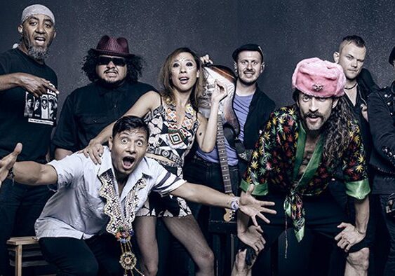 Group of diverse people posing enthusiastically.