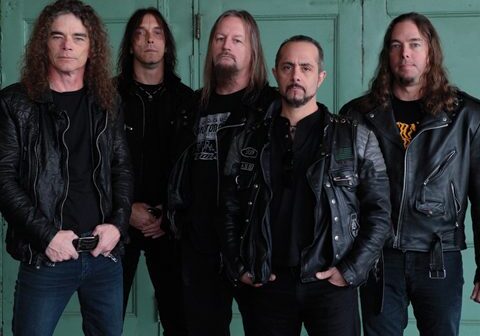 Five men in black leather jackets.