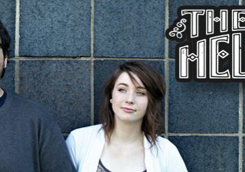 Two people standing, "The Oh Hellos" text.