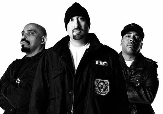 Three men in black and white portrait.