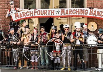 Marching band posing with various musical instruments.