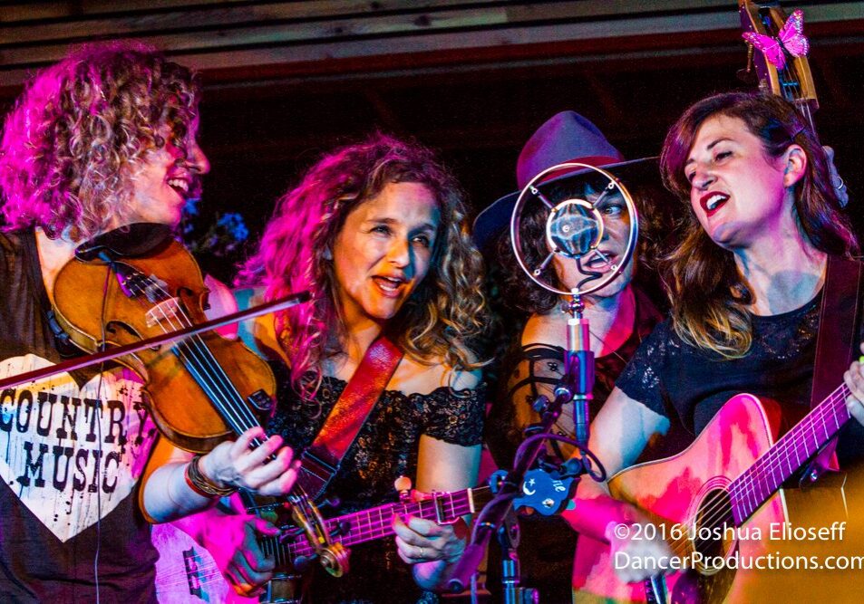 Women performing music with string instruments.