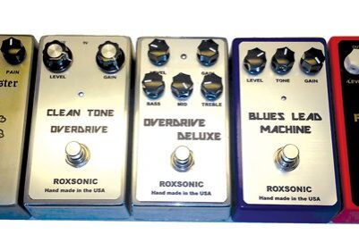 Five Roxsonic guitar effect pedals in a row.