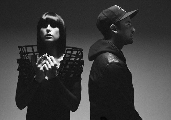 Two people in dramatic black and white.
