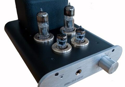 Vacuum tube amplifier with four visible tubes.