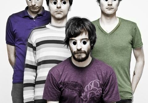Four men with oversized cartoon eyes.