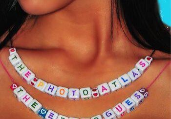 Necklaces with colorful letter beads displayed.