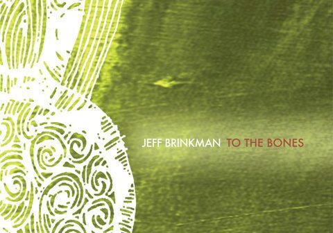 Green abstract album cover with intricate design.