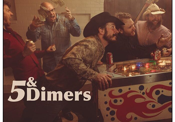 Band playing pinball in a lively setting.