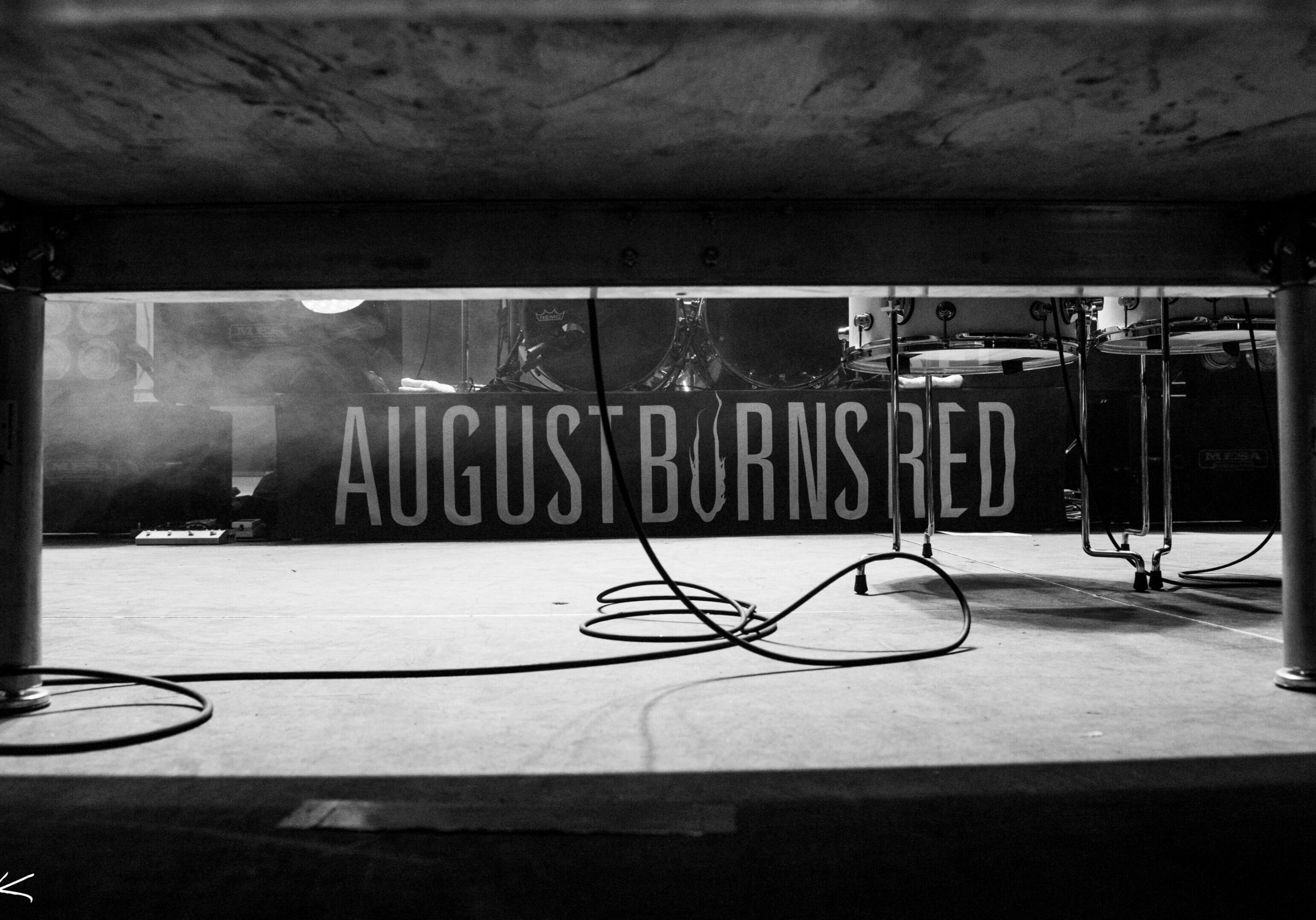 Concert stage with "August Burns Red" banner.