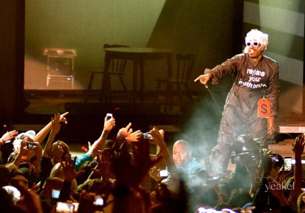 Performer on stage pointing at audience.