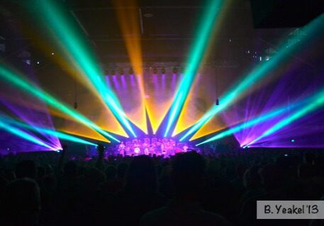 Concert stage with vibrant colorful lights.