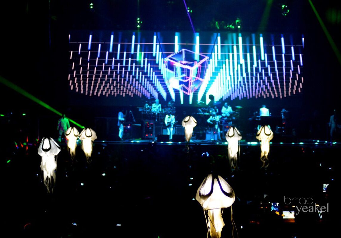 Concert with vibrant stage lights and decorations.