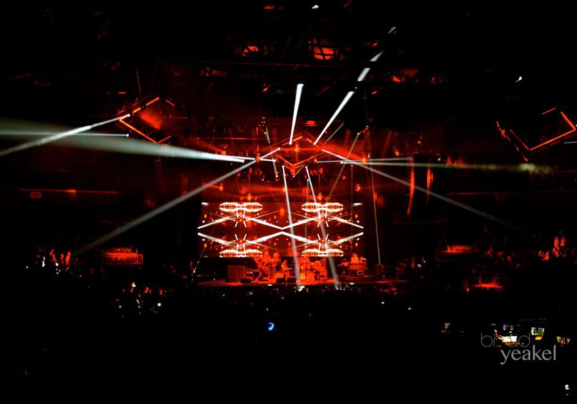 Concert stage with striking red lighting effects.
