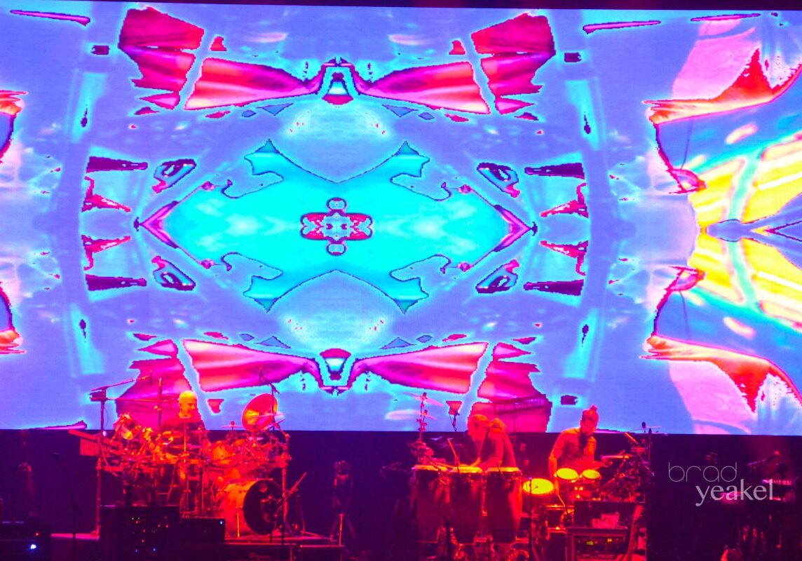 Colorful abstract projection with stage performance.