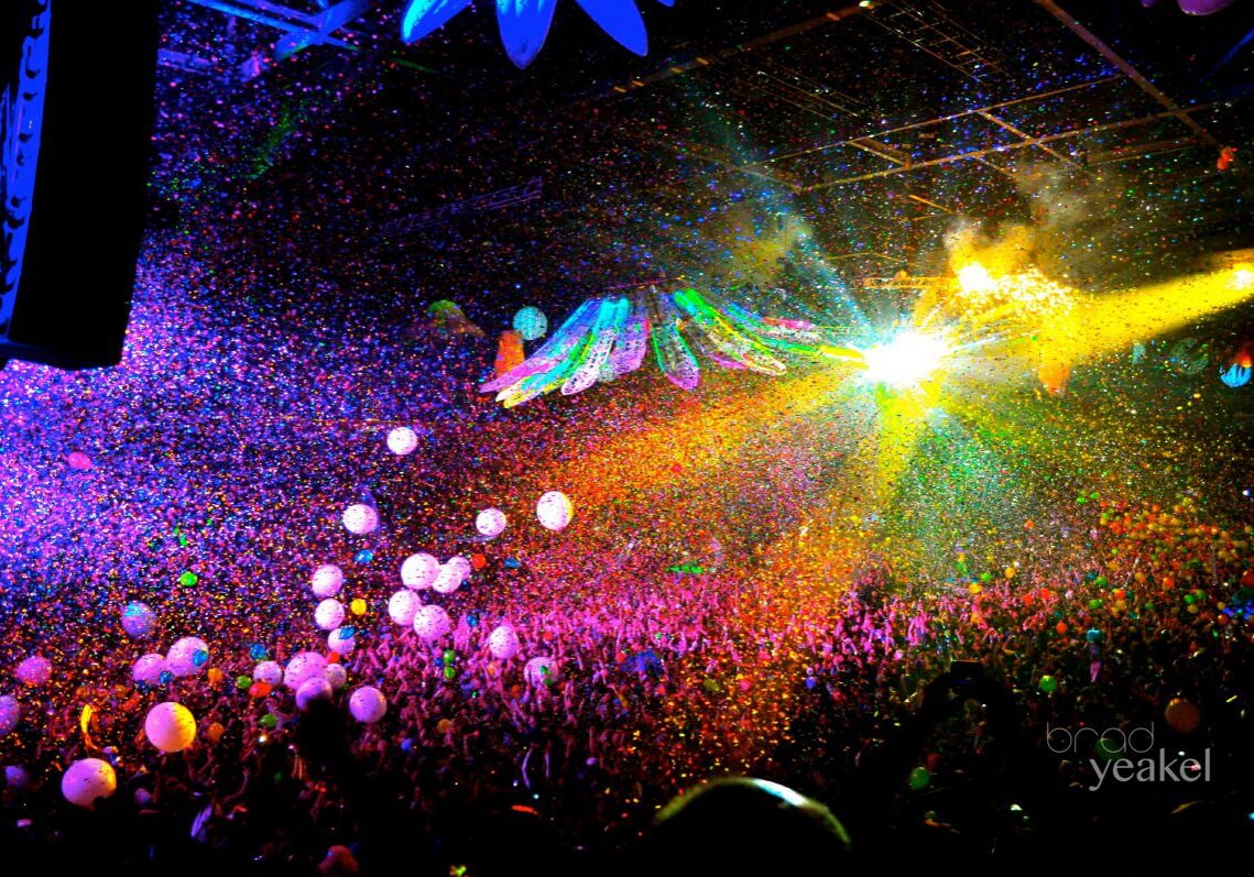 Colorful concert with lights and confetti.