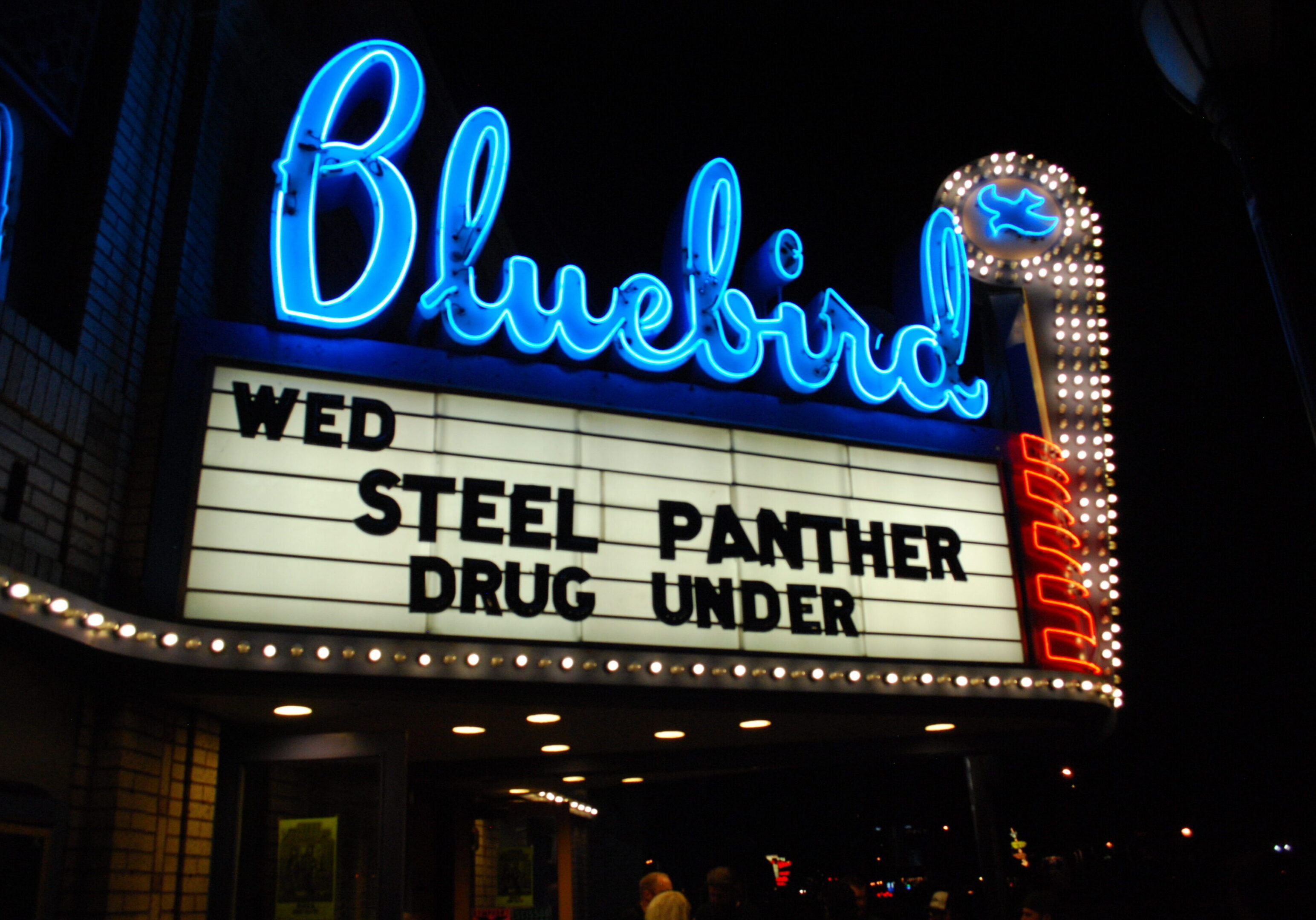 Bluebird theater marquee with concert details.