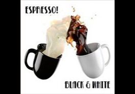 Two mugs with coffee and cream splashing.