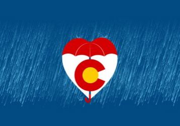 Heart-shaped umbrella with Colorado flag design.