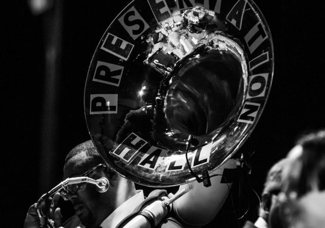 Musician playing sousaphone with "Preservation Hall.