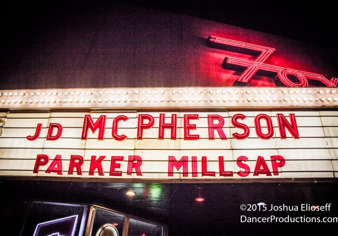 Marquee sign with band names in lights.