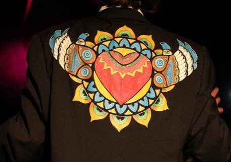Jacket with colorful heart and wing design.