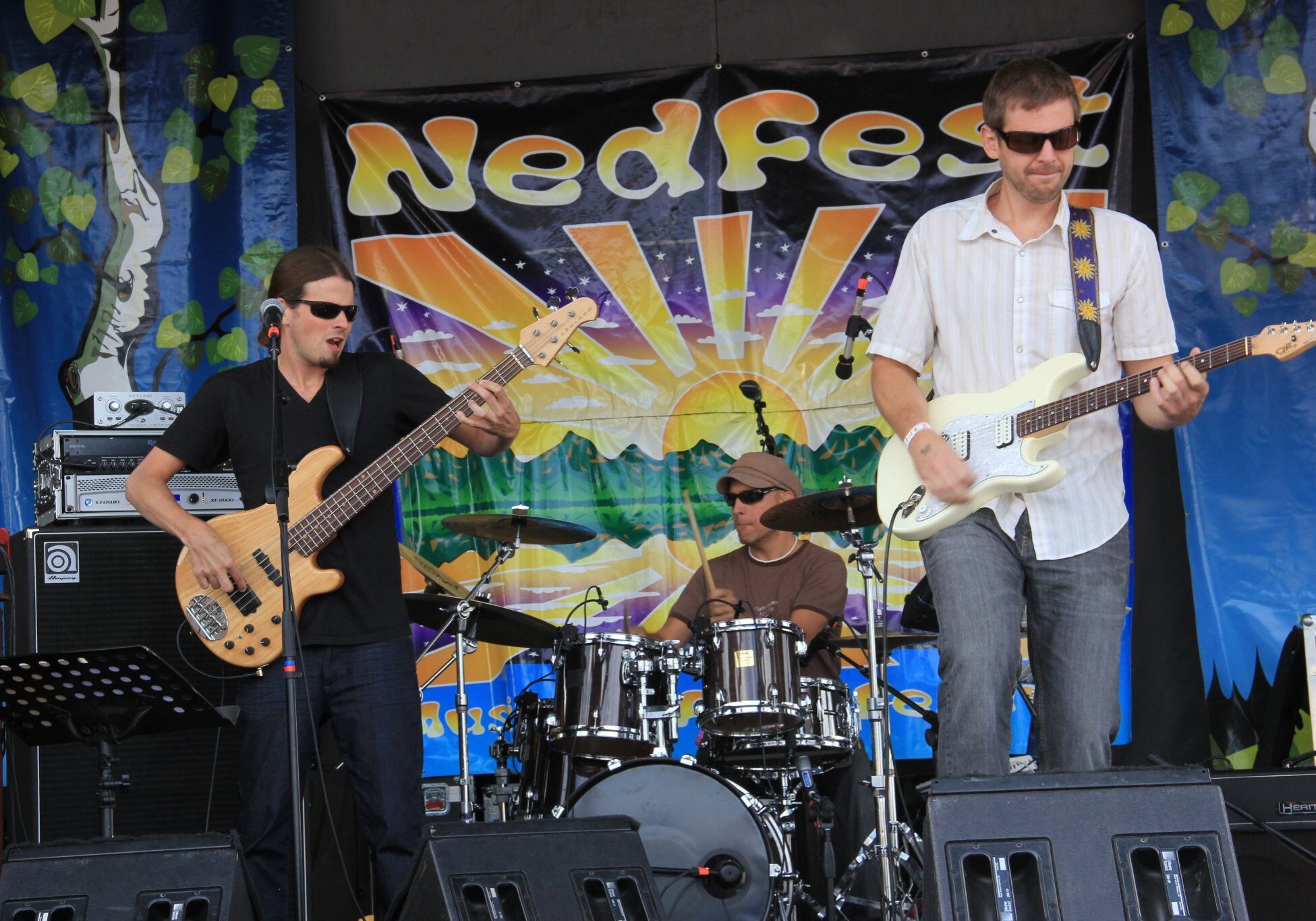Band performing on stage at music festival.