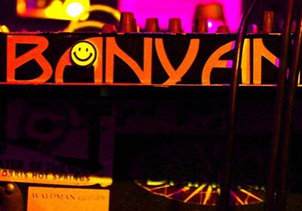 Colorful "BANYAN" text with a smiley face.