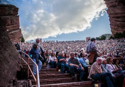 Outdoor concert crowd at Red Rocks Amphitheatre.