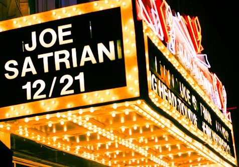 Theater marquee with Joe Satriani concert date.
