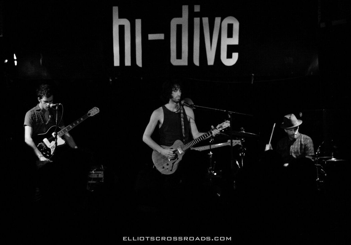Band performing on stage at hi-dive venue.