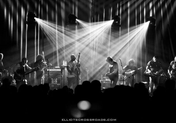 Black and white band performing on stage.