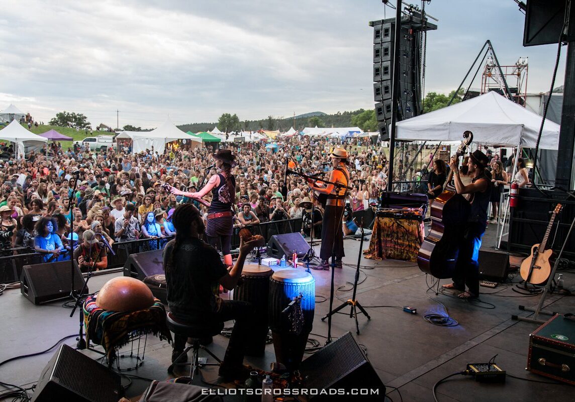 Band performing at outdoor music festival.