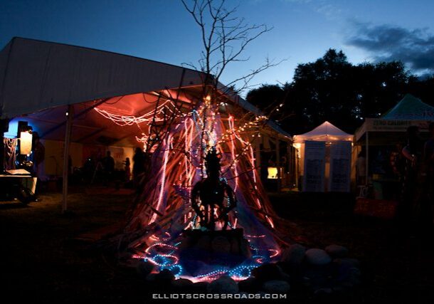 Festival installation with colorful lights at night.