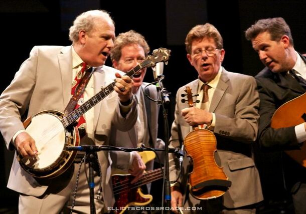 Bluegrass band performing with banjo and fiddle.