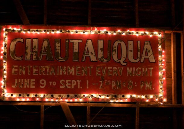 Sign with lights advertising nightly entertainment.