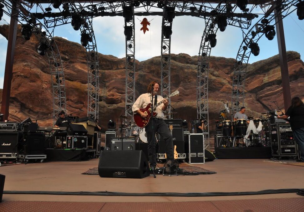 Outdoor concert at Red Rocks Amphitheatre stage.