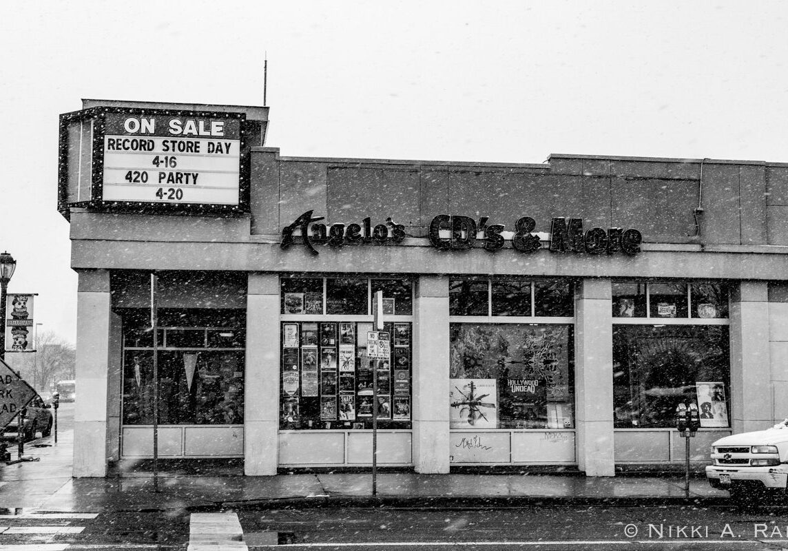 Record store building with event sign.