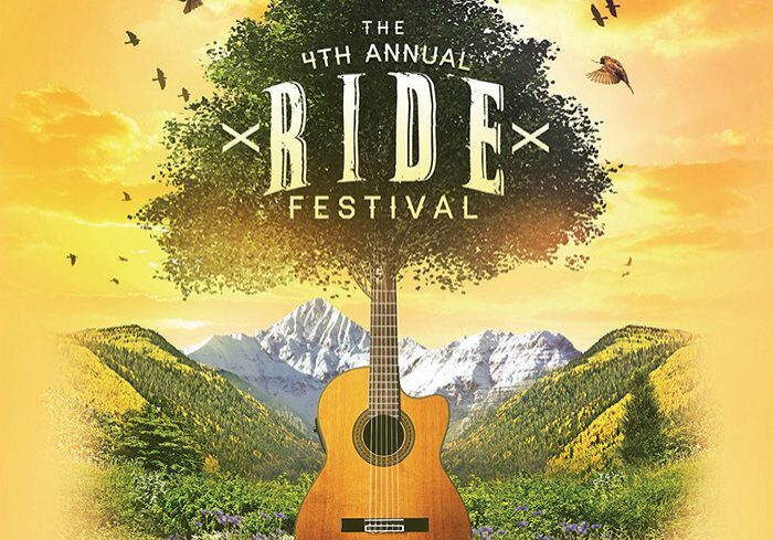 Guitar and tree with mountain background.
