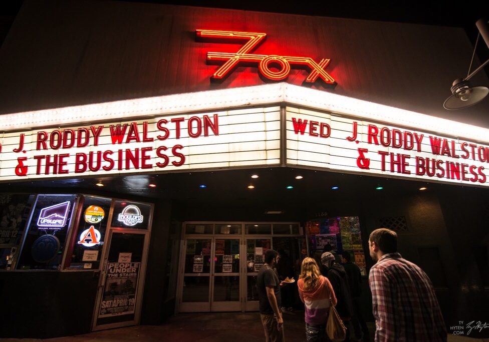 People outside Fox Theater at night.